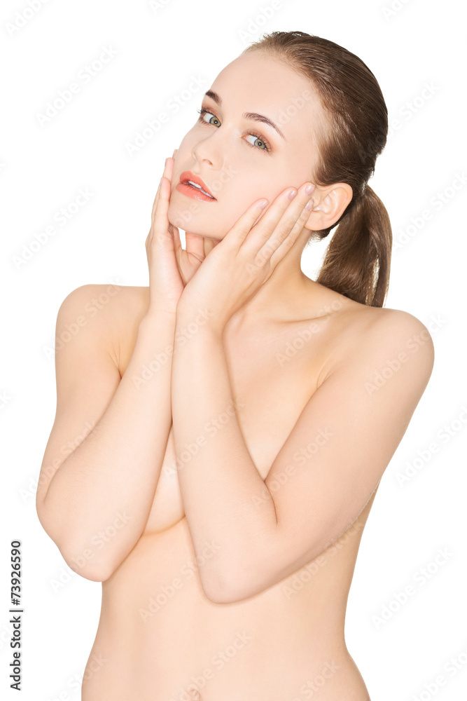 Naklejka premium Sensual portrait of nude woman touching her face