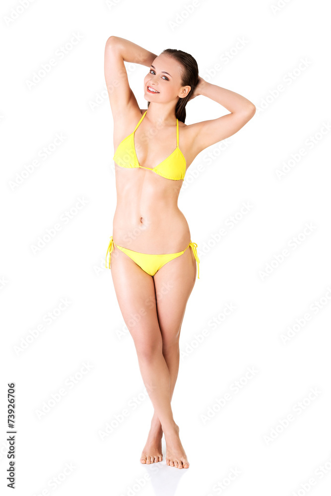 Full length woman in bikini looking at the camera Full length woman in bikini looking at the camera