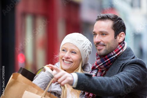 Young attractive couple with shopping bags