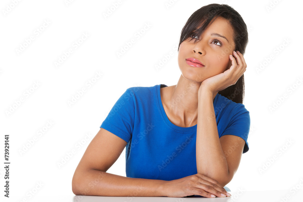 Portrait of thoughtful woman sitting at the desk Portrait of thoughtful woman sitting at the desk