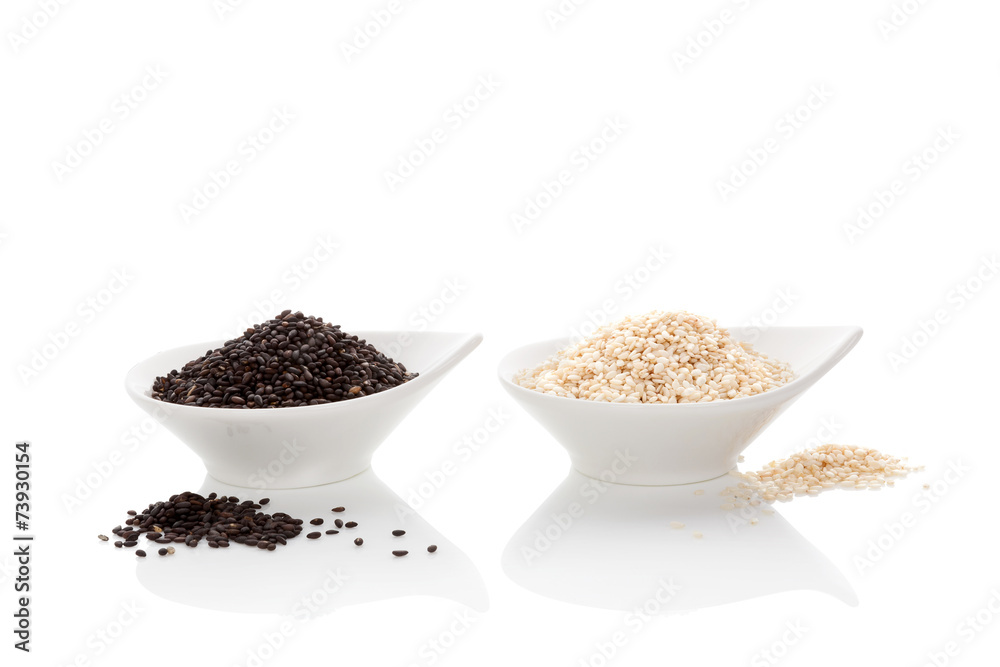 Black and white sesame seeds isolated on white. Black and white sesame seeds isolated on white.