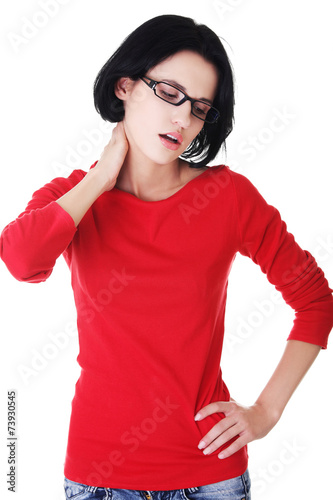 Young woman suffering from neck pain