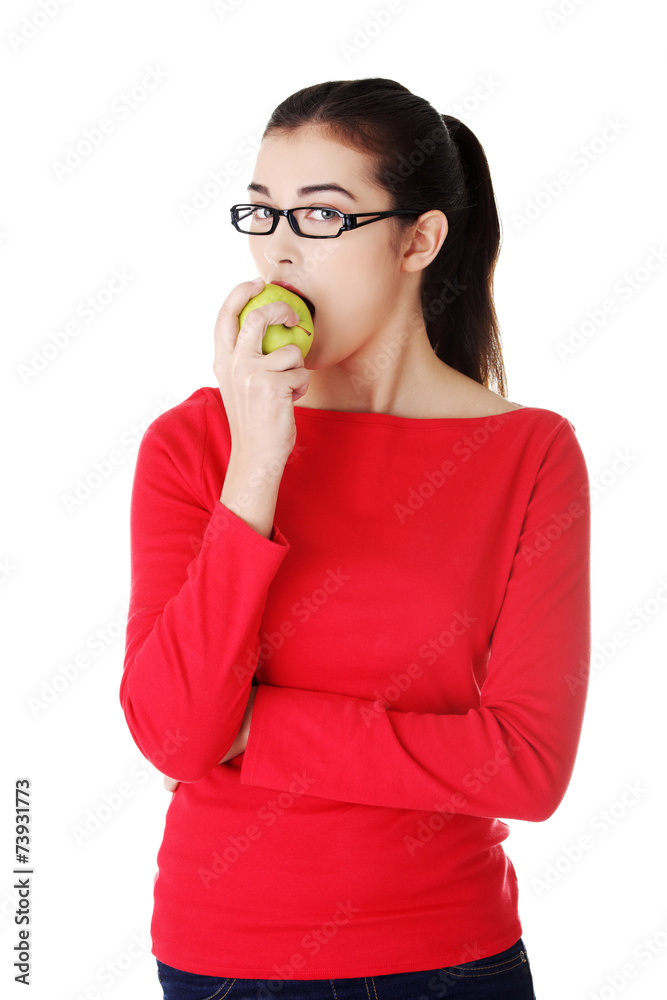 Portrait of beautiful woman eating an apple Portrait of beautiful woman eating an apple