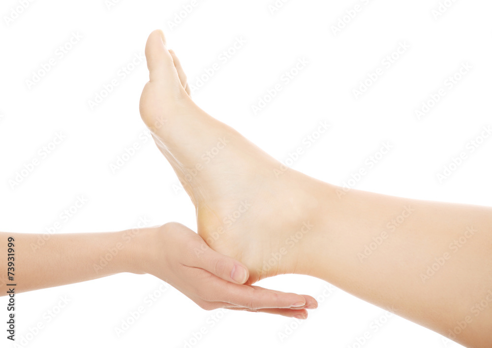 Woman touching her foot