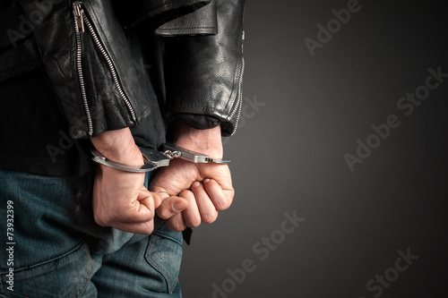 man hands in handcuffs
