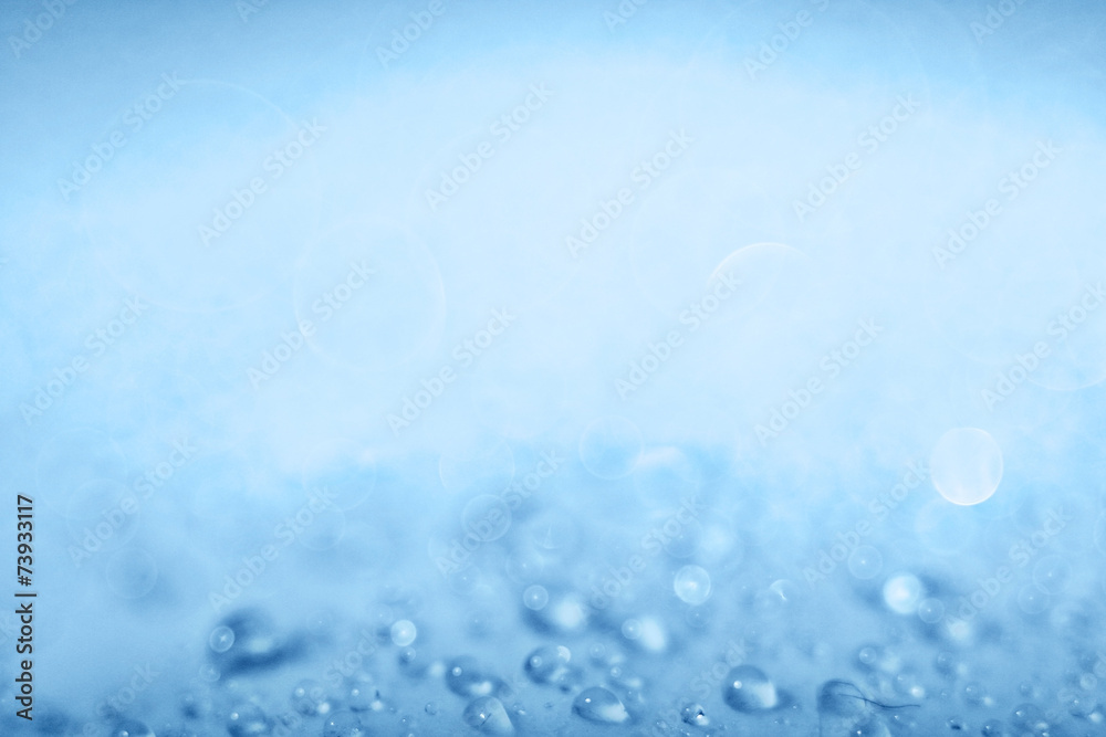 Blue light blurred background texture bokeh drops