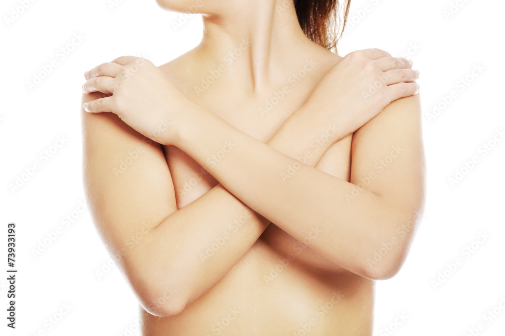 Fototapeta premium Close up on nude woman covering her breast