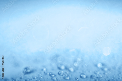 Blue light blurred background texture bokeh drops