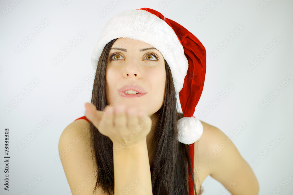 Woman santa blowing from hand Woman santa blowing from hand