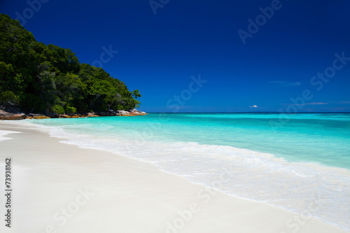Fototapeta Naklejka Na Ścianę i Meble -  White sand beach blue sea with clear sky