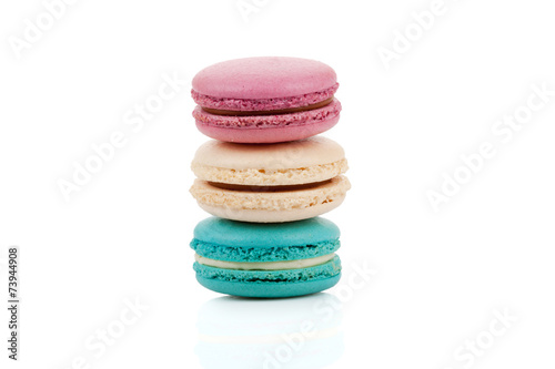 Three multicolored stacked macaroons isolated