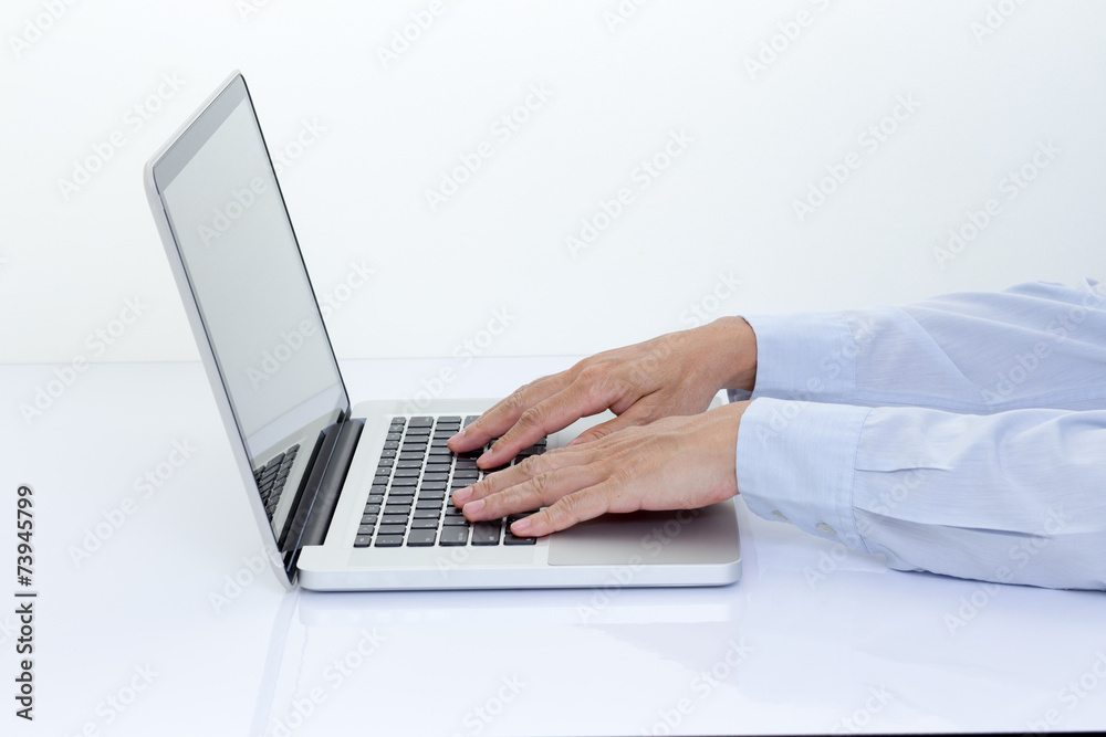 Businessman hands typing on laptop computer Businessman hands typing on laptop computer