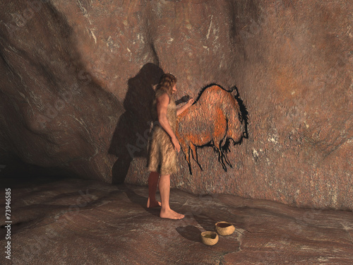 Cavernícola realizando una pintura rupestre photo