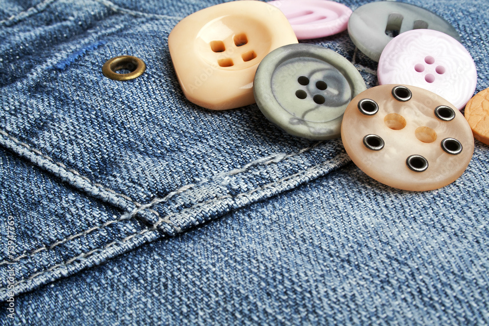 Colored buttons on denim Colored buttons on denim