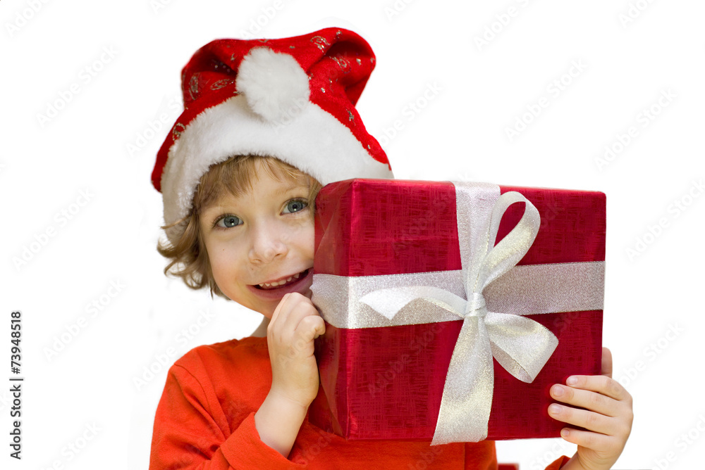 Cute kid with a Santa hat holding a present box Cute kid with a Santa hat holding a present box