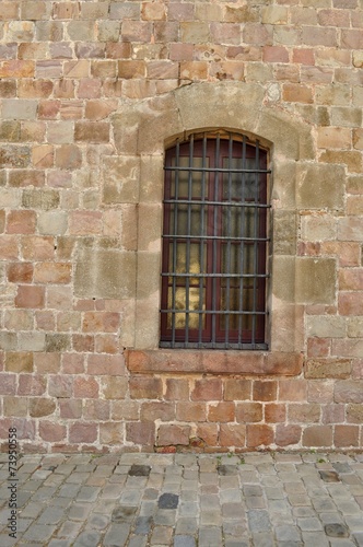 Rusty window, Montjuïc castle, Barcelona, Spain; military prison