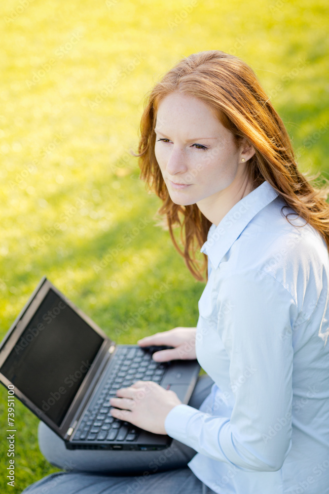 Woman with Notebook in a Park