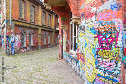 Graffiti brick wall art in germany © tomikk