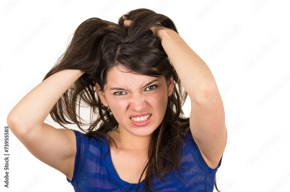 closeup portrait of angry young girl posing with hands on head closeup portrait of angry young girl posing with hands on head