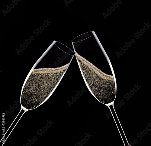Fényképezés Champagne flutes on black background