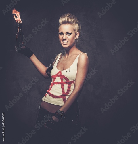 Valokuva Punk girl with a Molotov cocktail