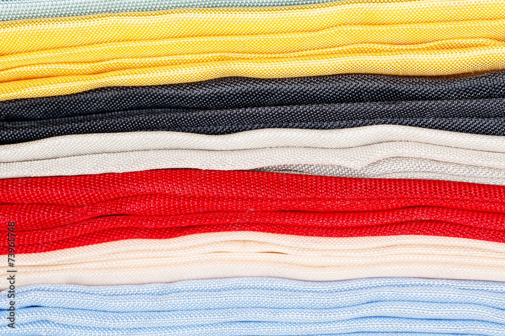 Various colorful fabric as background. Small depth of field