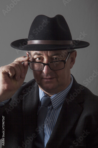 Serious men portrait with hat