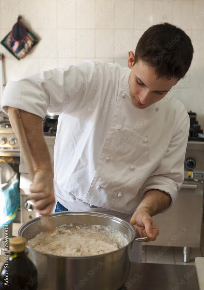 Chef mixing dough Chef mixing dough