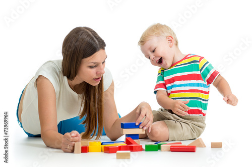kid and his mom play toys t...