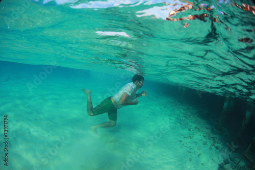 Man swimming in the ocean © hreniuca