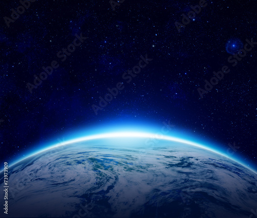 Fototapeta Naklejka Na Ścianę i Meble -  Blue Planet Earth, sunrise over cloudy ocean of world in space
