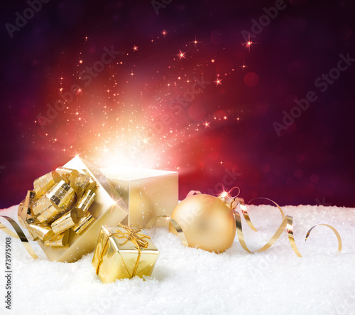 magic shining of christmas present on snow