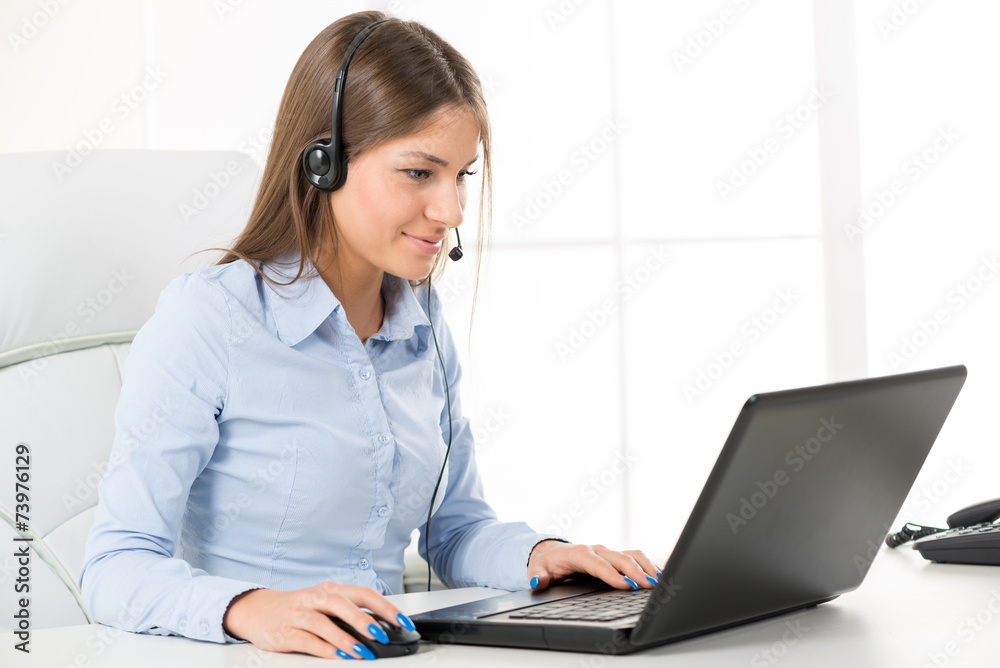 Bussineswoman With A Headphone, Typing On The Laptop Bussineswoman With A Headphone, Typing On The Laptop