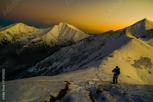 Sunset in mountains above clouds - Tatra Mountains in Poland