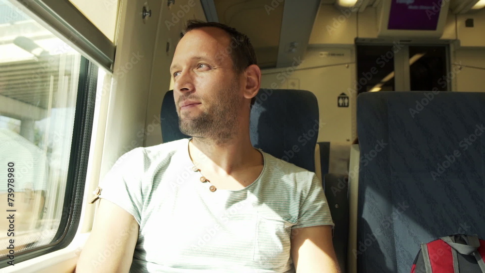 Young, handsome man enjoying a train travel Young, handsome man enjoying a train travel