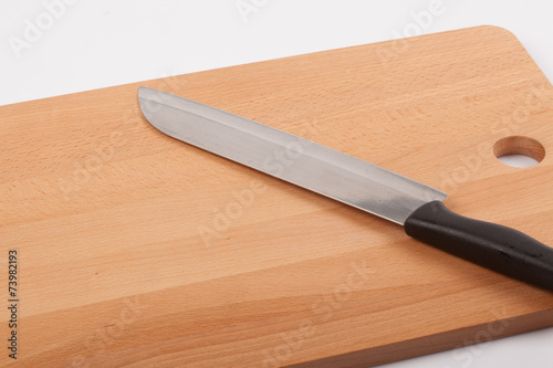 Knife and wooden chopping board