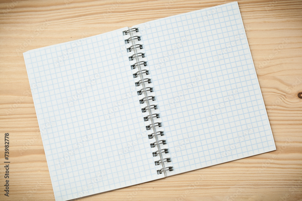 Notebook on a wooden table Notebook on a wooden table