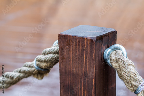 fence made of cord and wooden pier © jan_S