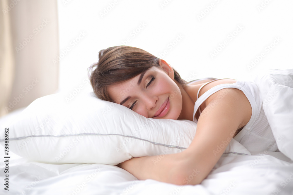 Beautiful girl sleeps in the bedroom, lying on bed Beautiful girl sleeps in the bedroom, lying on bed