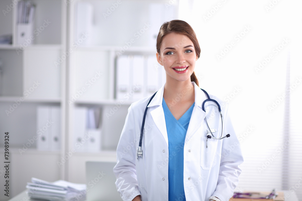 Portrait of happy successful young female doctor holding a Portrait of happy successful young female doctor holding a