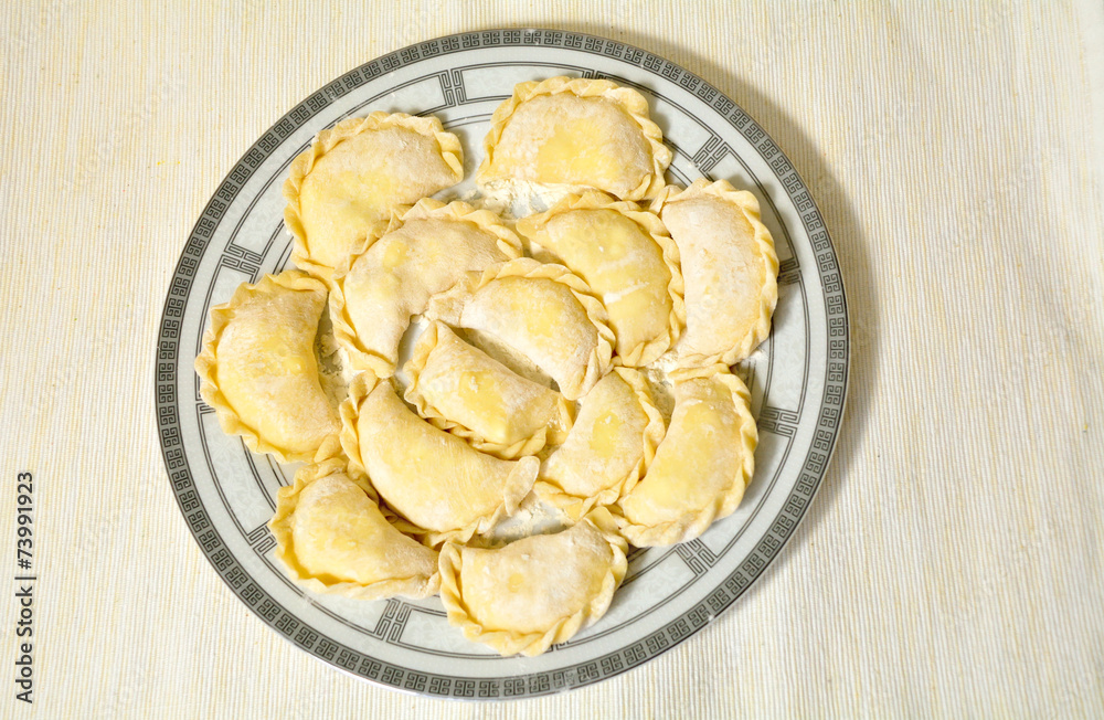 Homemade uncooked ravioli on the plate