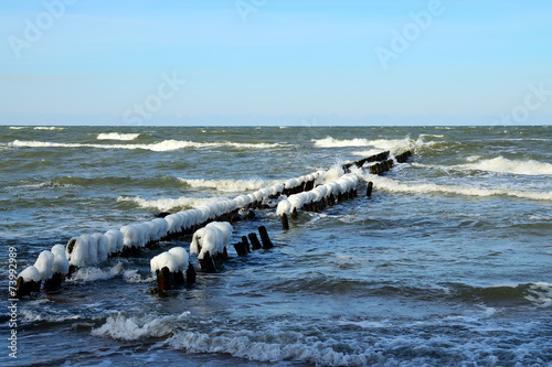 Breakwater covered with ice