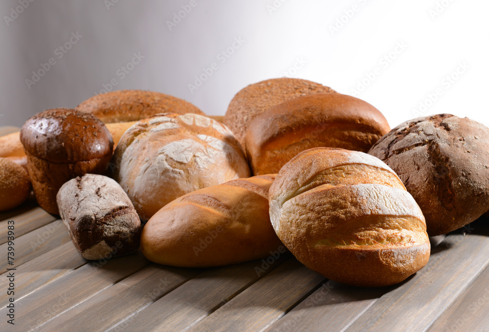 Fresh bread on table on white background Fresh bread on table on white background