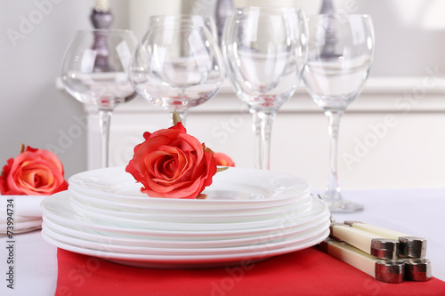 Festive table setting on room background