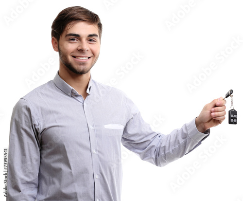 Businessman holding car key...