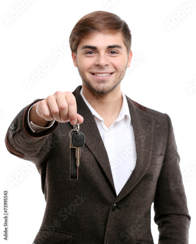 Businessman holding car key...