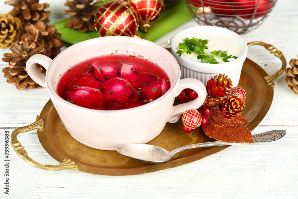 Traditional polish clear red borscht with dumplings and Traditional polish clear red borscht with dumplings and
