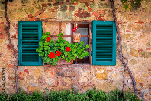 Beautiful window decorated with flowers in italy