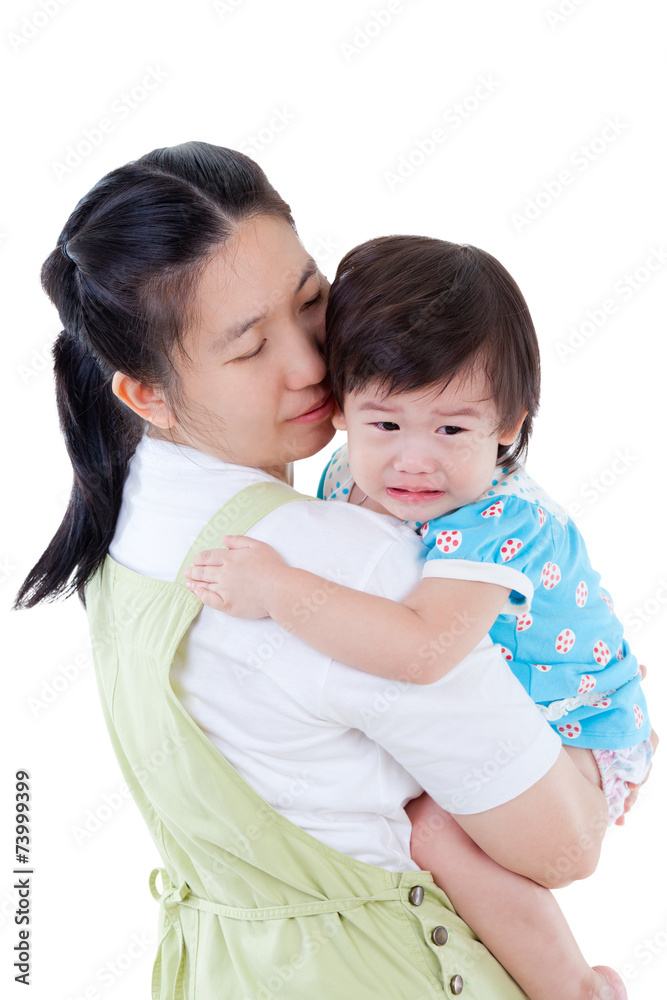 Asian mother carrying and soothe her daughter on white backgroun Asian mother carrying and soothe her daughter on white backgroun