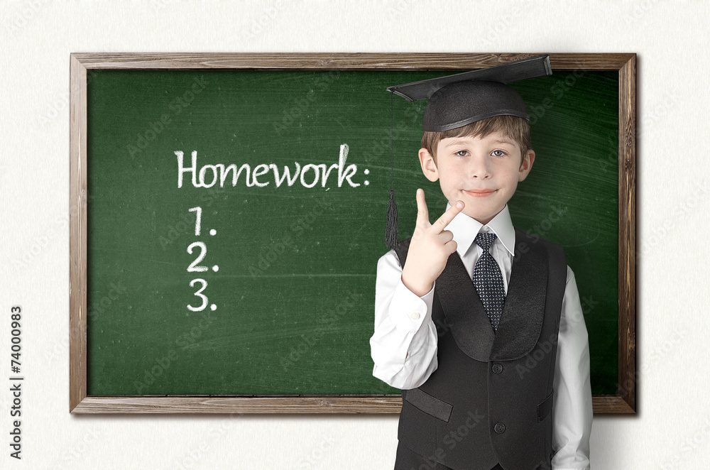 Cheerful little boy on blackboard. Looking at camera Cheerful little boy on blackboard. Looking at camera
